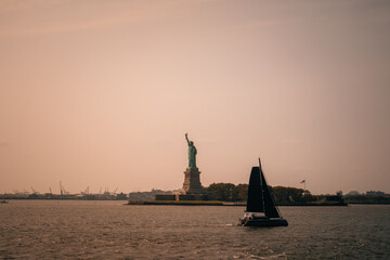 sunset over the river New York harbor statued liberty 