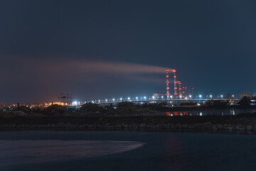 Beautiful city at night. Night city reflected in the water.