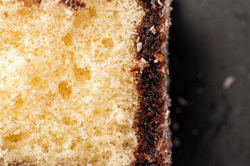 Delectable lamington, made with sponge cake, chocolate sauce and shredded coconut