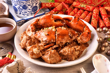 Sauteed crab with rice cake prepared for the lunar new year         