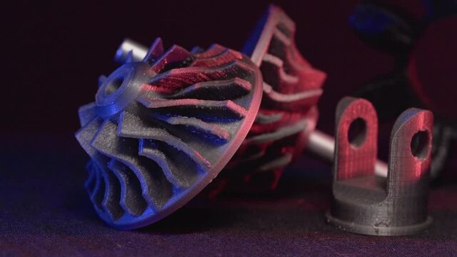 Replacement parts for machine tools in factories, printered on 5D 3D printers. Parts for faFused deposition modeling, 3D printer printing an object from plastic.
