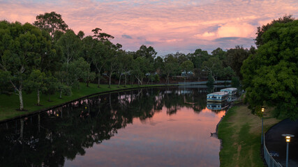Fototapeta na wymiar A pink Sunset over the river torrens in Adelaide South Australian on January 25th 2021
