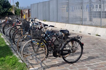 A bicycle parked on the side of a building