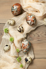 Easter composition - Easter eggs painted with natural dyes on a wooden table