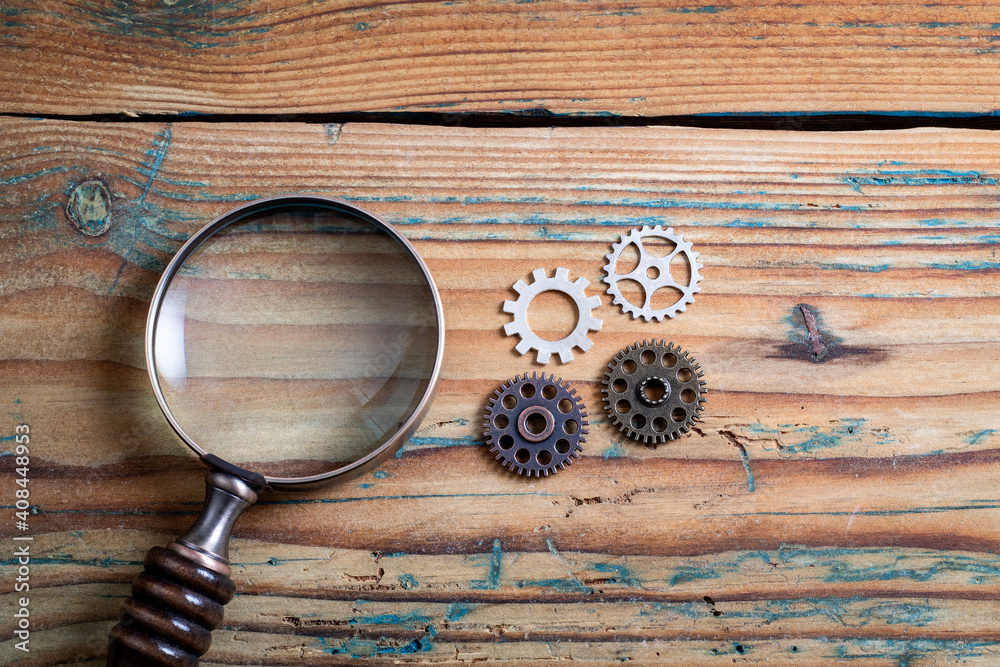 Canvas Prints optimization, improvement and development concept. gears of different sizes and a magnifying glass o