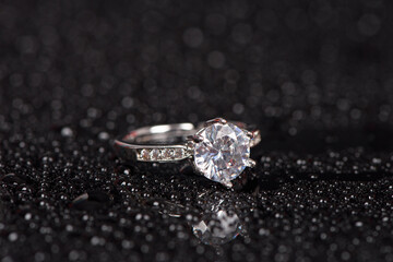 Diamond Ring and drops Isolated on black background