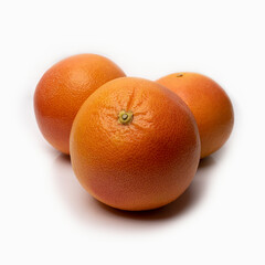 grapefruit on a white background with reflected shadows