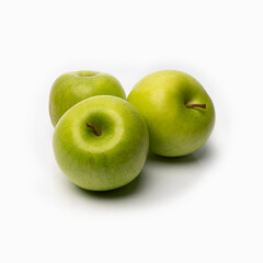 green apples on a white background with a shadow