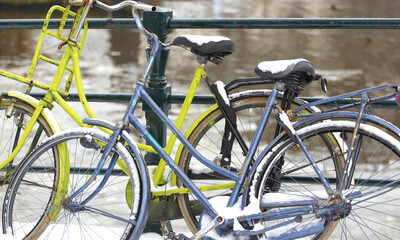 Fototapeta na wymiar Bikes in Amsterdam parked outside.