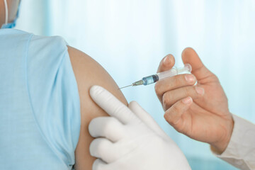 close up doctor holding syringe to injection to the patient in medical. Covid-19 or coronavirus vaccine. virus removal and prevention concept