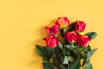 Red roses on yellow background. Flat lay, top view, free copy space. - 408453191
