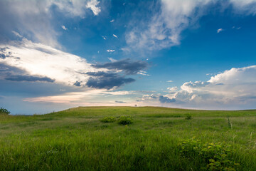 Hilly Landscape With Two Person Far Away