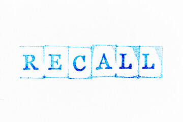 Blue color ink rubber stamp in word recall on white paper background