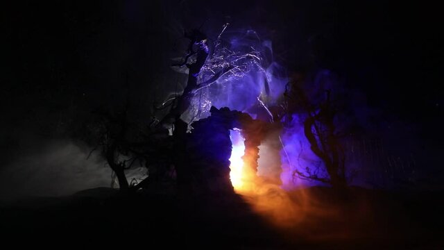 Old stone house burning uncontrollable in the night. A fire in a country house. Creative artwork decoration. Selective focus