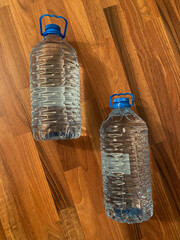 water canister on a wood parguet background