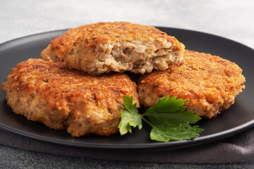 Buckwheat cutlets with cheese and parsley on a plate. Healthy diet food
