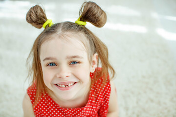 Little girl has no tooth. the child has lost a baby tooth. High quality photo