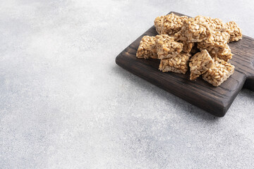 Sunflower seeds in sugar glazed, oriental sweetness of brittle. Kozinaks are broken into pieces on...