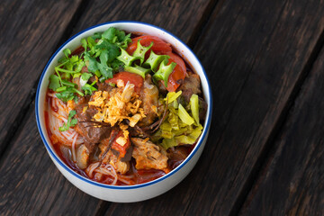 Traditional spicy rice noodle soup name of food is Nam Ngiao Rice Noodle or Khanom Jin Nam Ngiao