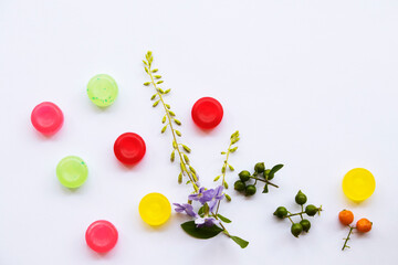 Naklejka na ściany i meble cough sore throat pastille colorful extract from herbal with purple flowers arrangement flat lay style on background white 