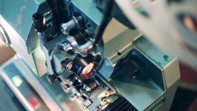 Detailed image of a vintage film projector at work