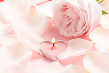 Pink roses and heart-shaped candles