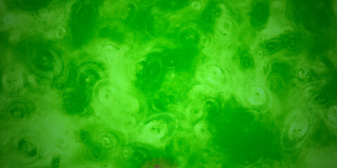green abstract acrylic background with brush strokes and splashes	