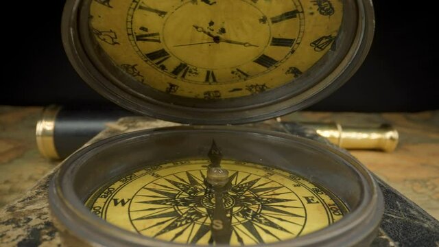 The pocket clock with the compass on the other side as seen on a closer look