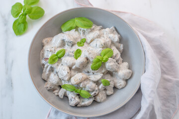 home made gnocchi with mushrooms and arugula
