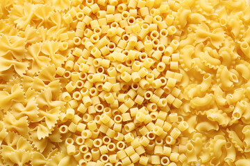 Dry pasta as background, top view