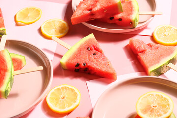 Plates with slices of ripe watermelon on table