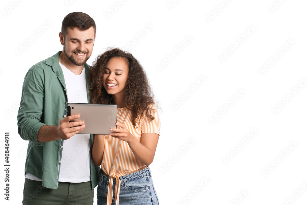 Canvas Prints Young couple with tablet computer on white background