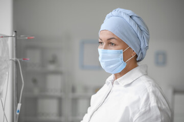 Mature woman undergoing chemical therapy course in clinic