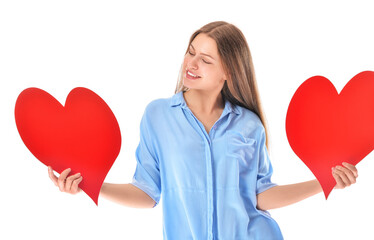 Young woman with red hearts on white background