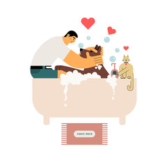 In the tub sits a guy dogsitter and shampoos the dog, next to a cute cat.