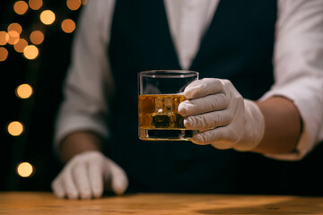 Barman pouring whiskey whiskey glass beautiful night