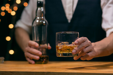 Barman pouring whiskey whiskey glass beautiful night