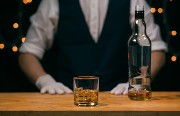 bartender pouring whiskey