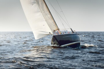 Heeled sloop rigged yacht sailing in an open Baltic sea on a clear day. Regatta, racing, sport,...