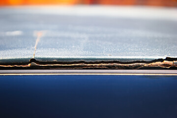 Bad body car repair. Putty peels off the body.