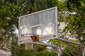 Dirty and Weathered basketball hoop on the street, Side View. Stock Photo.