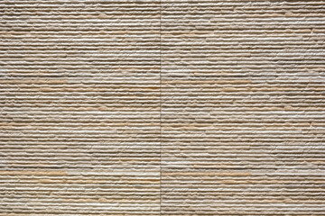 Abstract texture of a tiled wall in bright sunlight. Stock Photo.