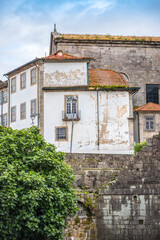Old houses with grass-covered roofs on Rua De D. Hugo street in Porto, Portugal
