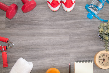 Gym stuff lifestyle flat lay with copy space concept, sneaker exercise healthy lifestyle sport or athletes equipment, fitness accessories dumbbells and bottle of pure water on wooden background