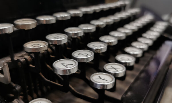 Background image of vintage typewriter keys with selective focus.