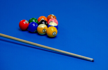 Background image of Billiard balls in a blue pool table.