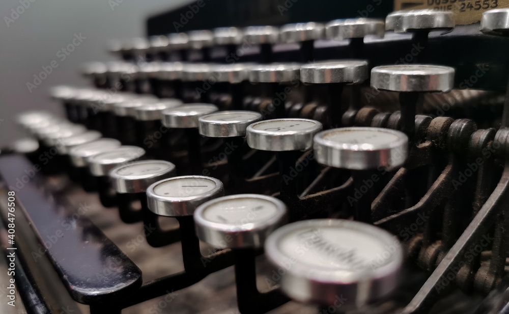 Fototapete background image of vintage typewriter keys with selective focus.