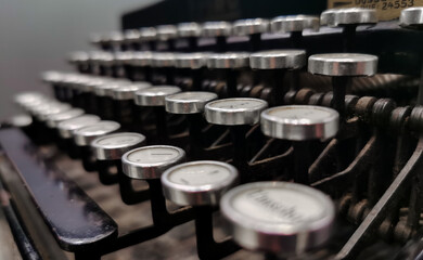 Background image of vintage typewriter keys with selective focus.