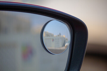 Close up of blind spot vehicle side mirror
