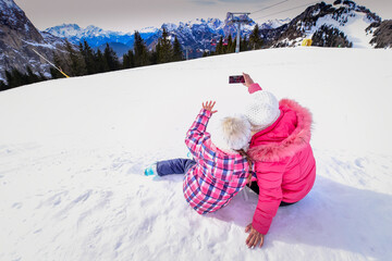 
Skiing, winter, snow, sun and fun - kids, boy and girl having fun in the Alps. Child skiing in the mountains.  - obrazy, fototapety, plakaty